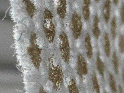 non woven carrier material with mineral dots and drainage perforation